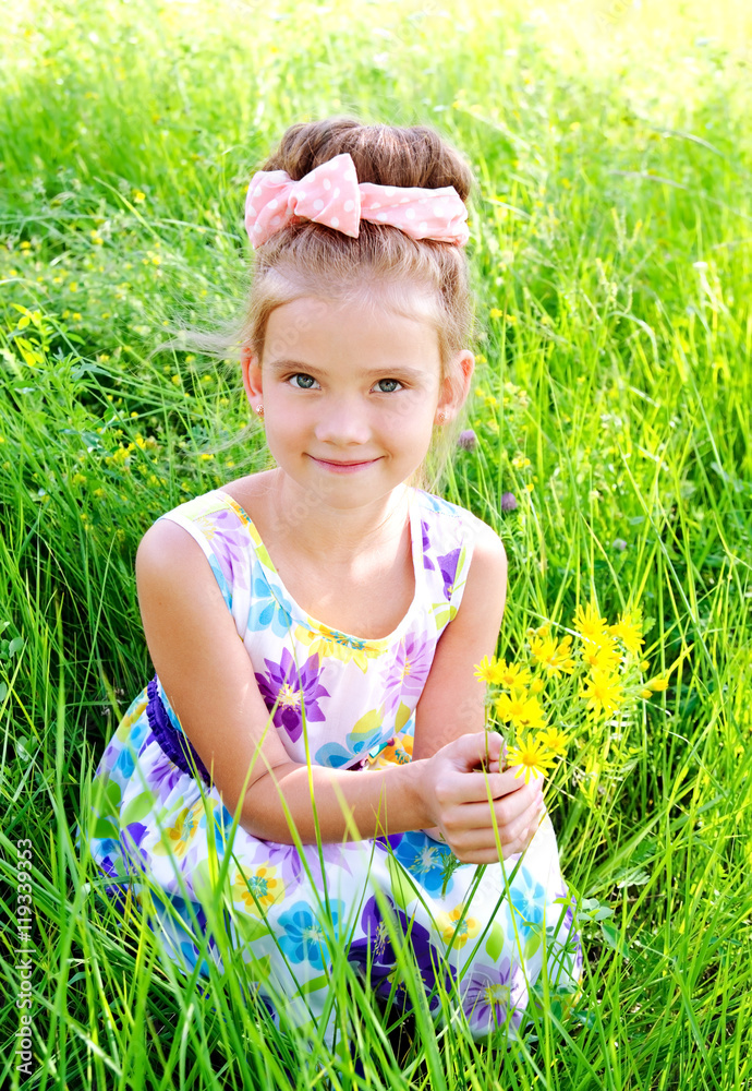 Adorable smiling little girl on the meadow in summer day Adorable smiling little girl on the meadow in summer day