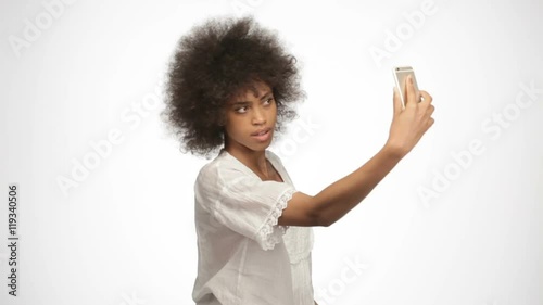 beautiful african american girl doing selfie with smart phone