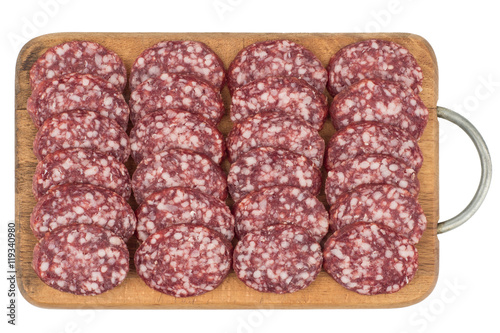 Sliced salami sausage on a cutting board. Isolated on white back