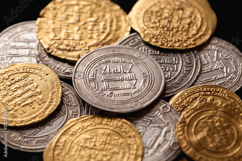 Pile of ancient golden and silver islamic coins