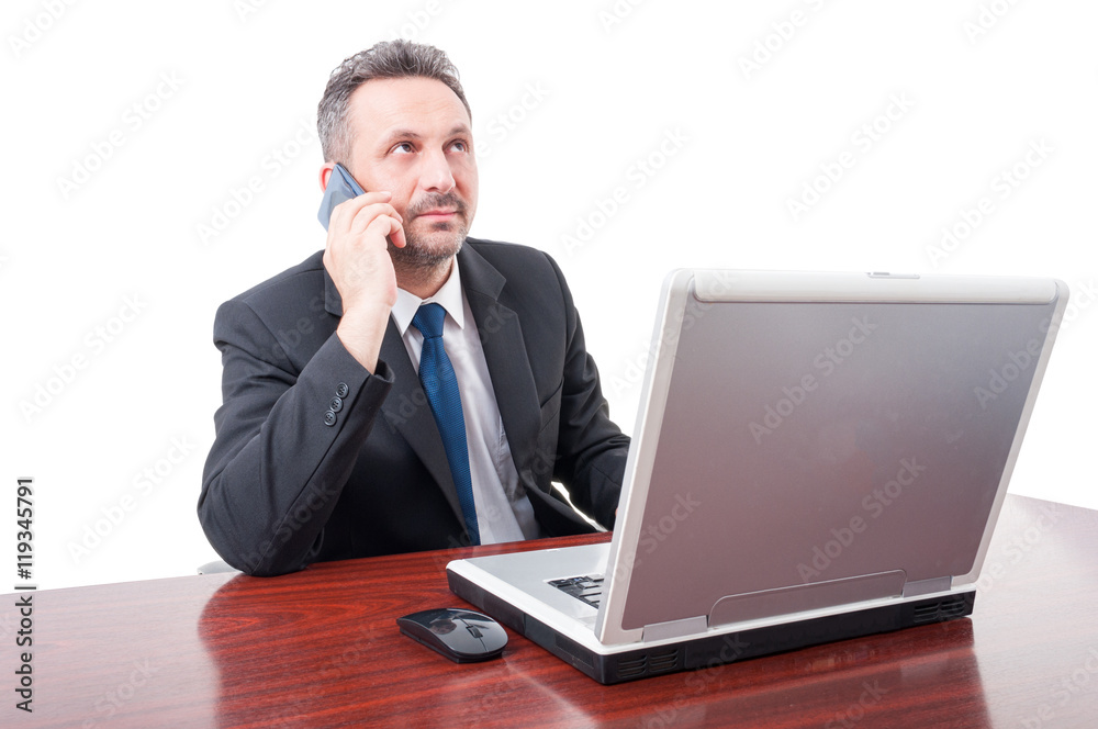 Young broker talking business on cellphone Young broker talking business on cellphone