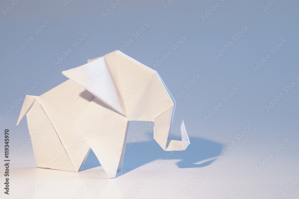 Obraz premium Origami elephant out of paper isolated on white background
