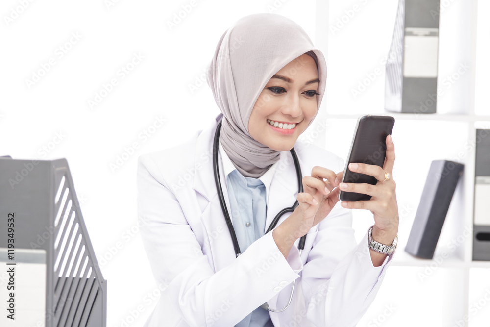 beautiful asian female doctor using mobile phone beautiful asian female doctor using mobile phone