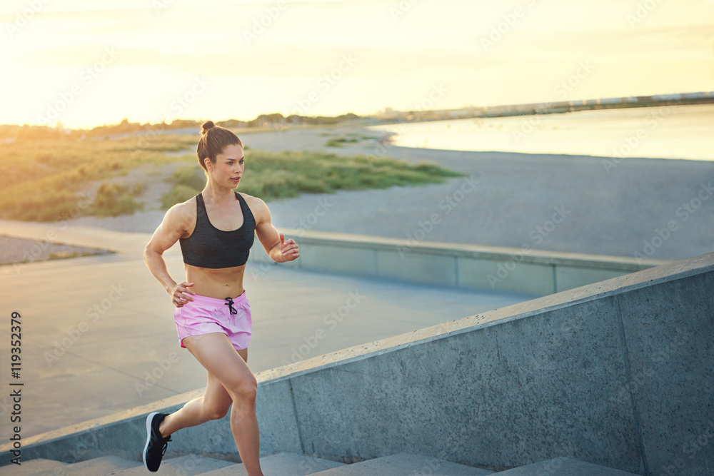 Toned healthy young woman out jogging