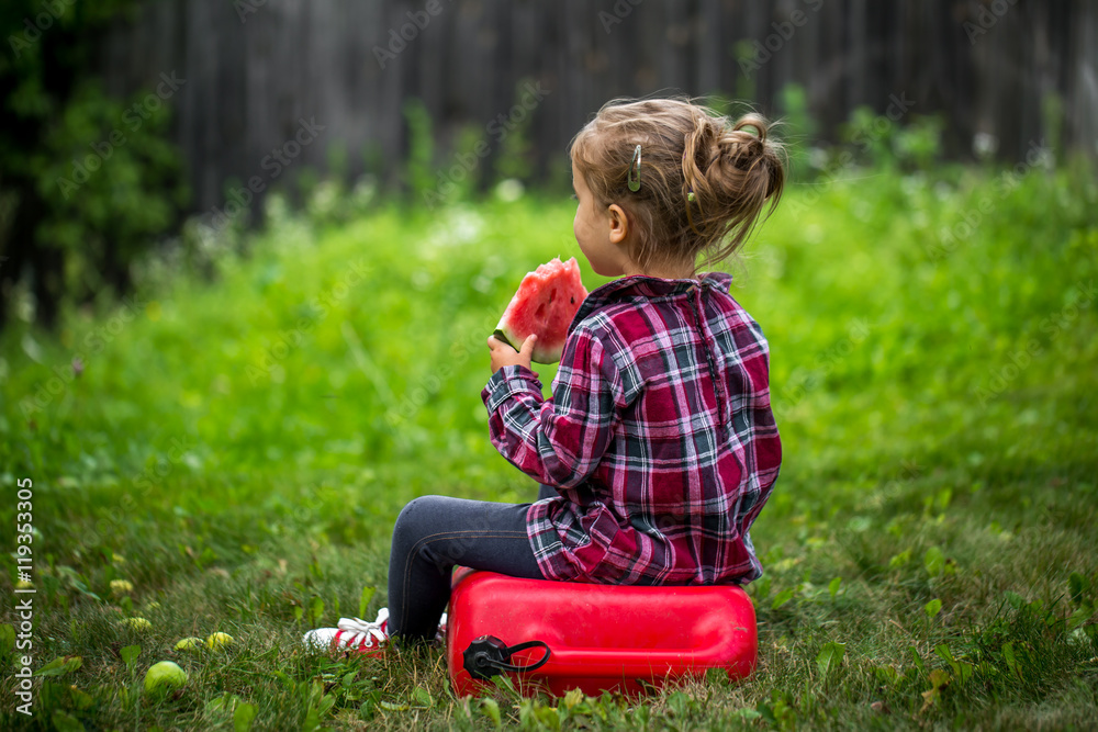 little girl eating watermelon in the summer little girl eating watermelon in the summer