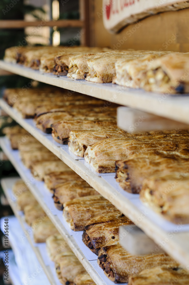 Racks full of traditional strudel in a bakery Racks full of traditional strudel in a bakery