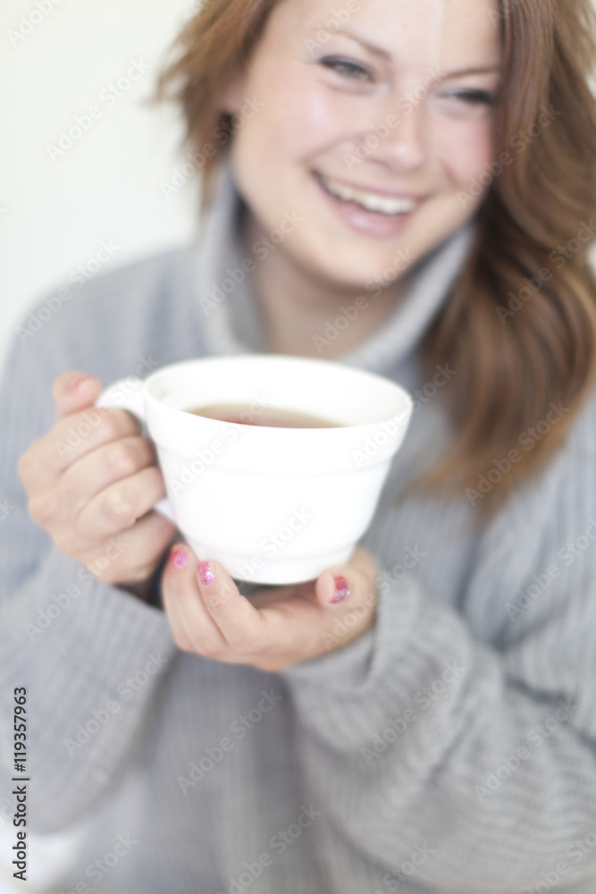 Smiling young woman having coffee Smiling young woman having coffee