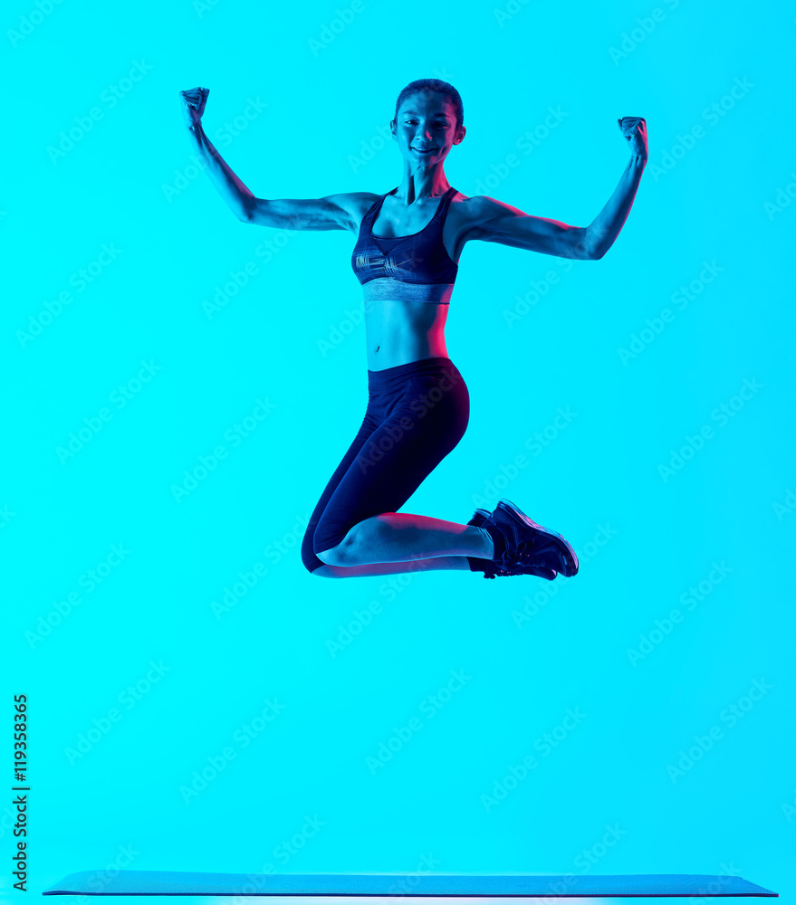 woman fitness exercices jumping isolated