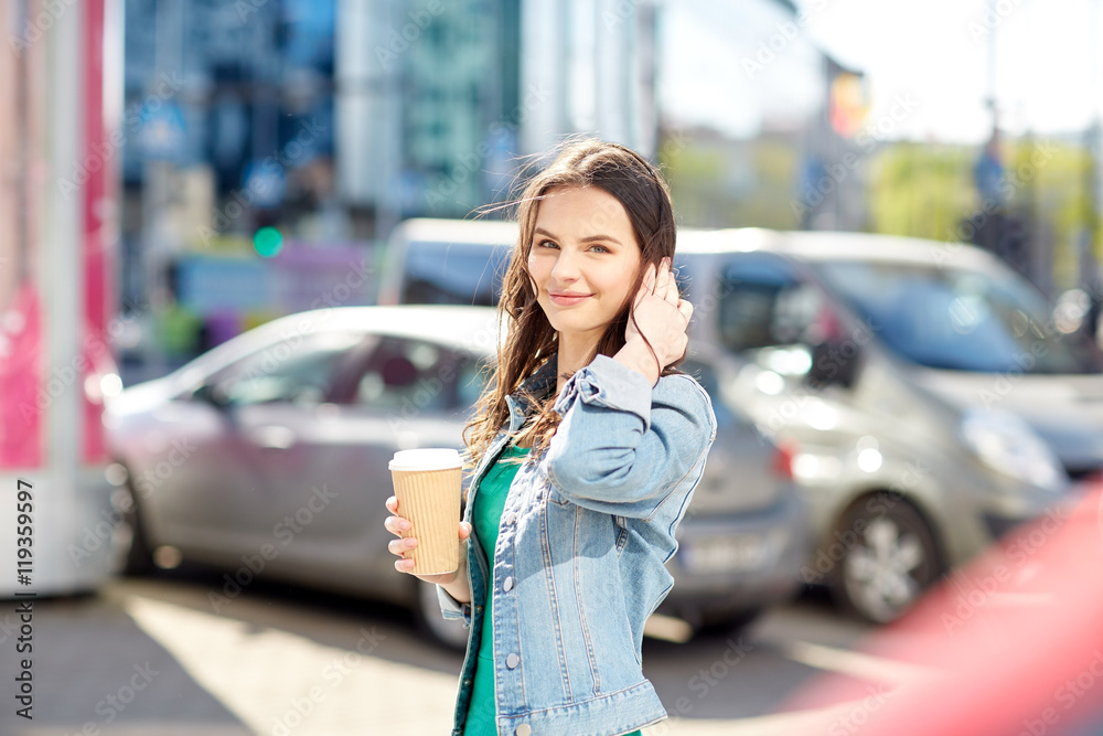 happy young woman drinking coffee on city street happy young woman drinking coffee on city street