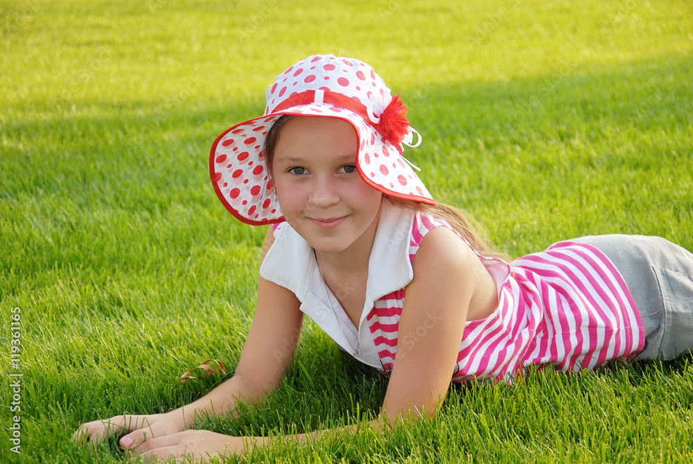 Cute little girl lying on grass Cute little girl lying on grass