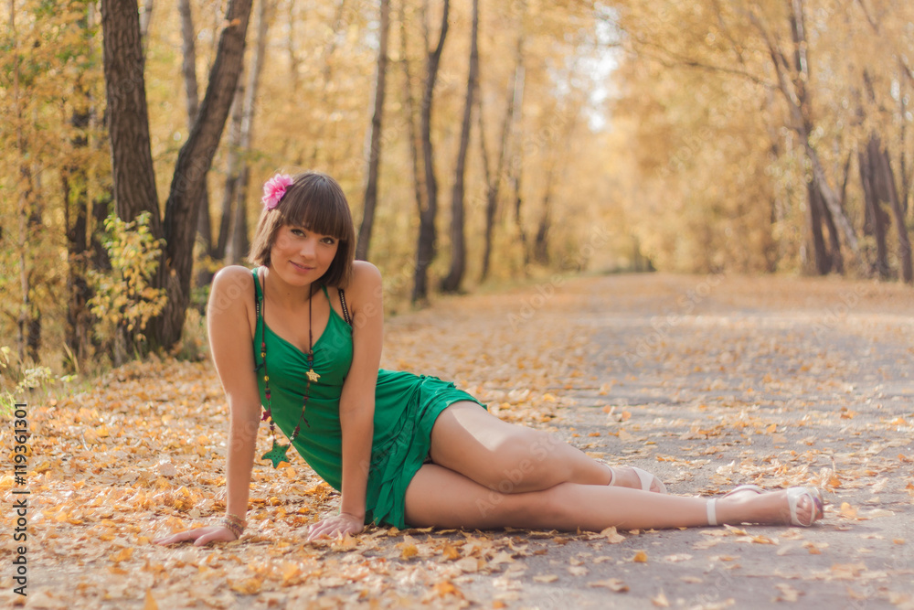 Beautiful girl in autumn park