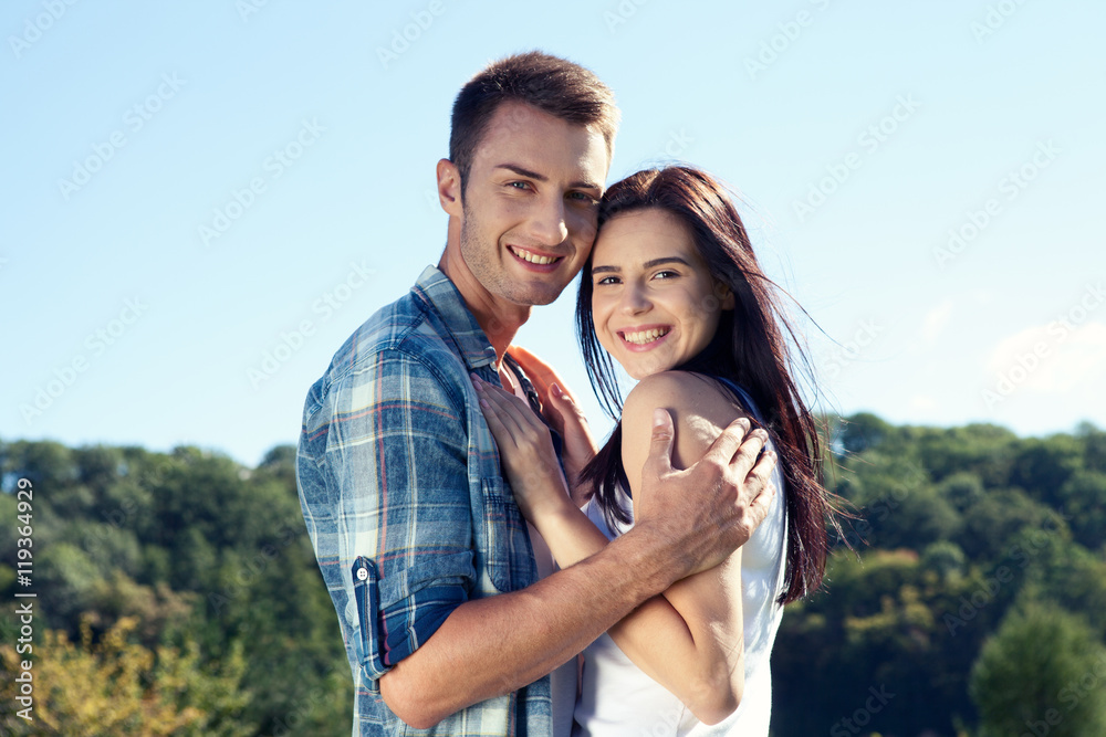 Portrait of happy couple laughing at camera Portrait of happy couple laughing at camera