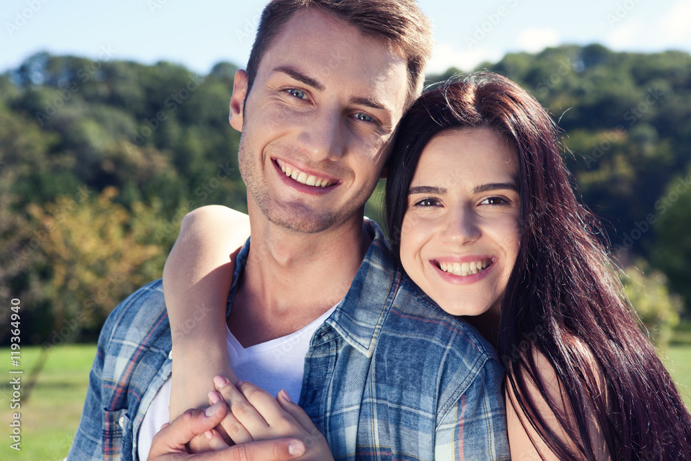 Portrait of happy couple laughing at camera Portrait of happy couple laughing at camera
