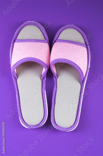 Home slippers for women on a bright background. Flat lay.
