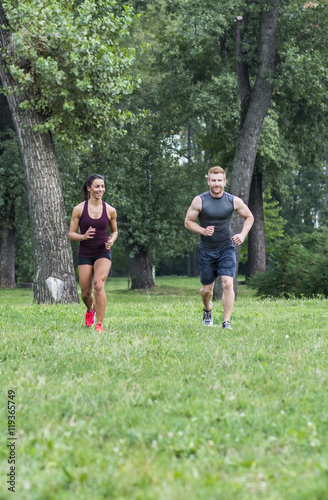 Fototapeta Naklejka Na Ścianę i Meble -  Young couple running