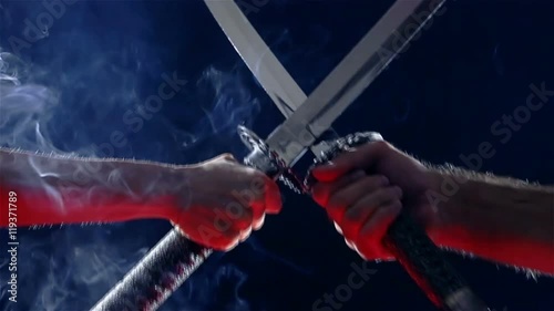 Japanese samurai warriors fighting with swords. Sword battle. Two Japanese katana sword. Blade close-up on a dark background with blue light filter with incense smoke. Steel tempering