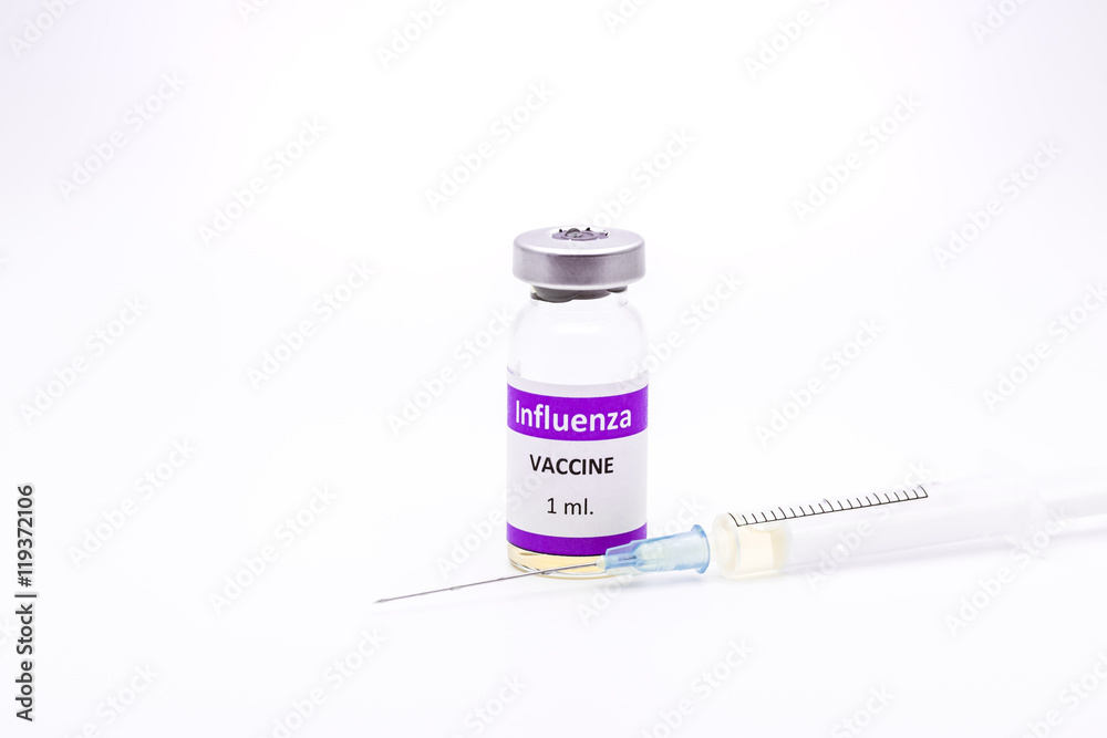 Influenza H1N1 vaccine and syringe on white background Influenza H1N1 vaccine and syringe on white background