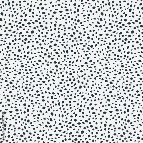 Black scattered dots on white background. Vector seamless pattern