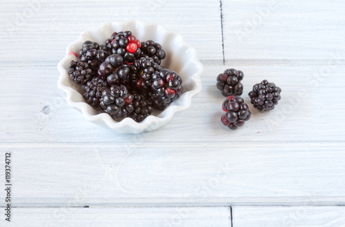 Blackberries on white wooden table