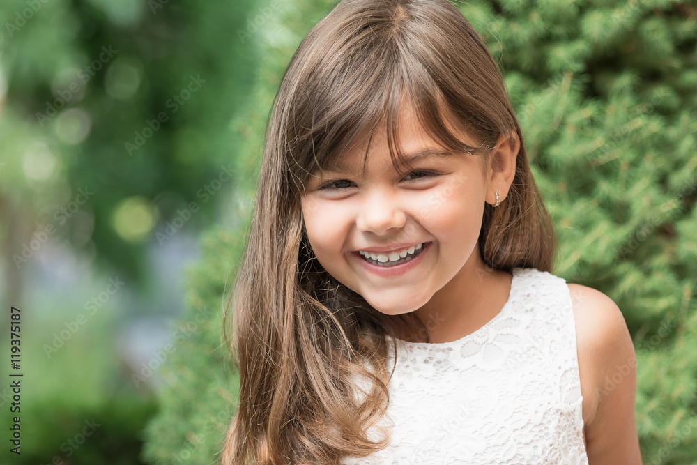 Portrait of laughing attractive little girl outdoors. Portrait of laughing attractive little girl outdoors.
