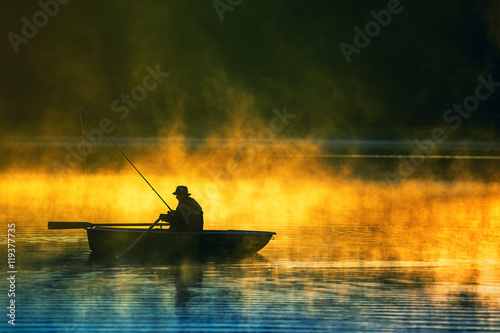 man fishes in the lakes of the Mazury