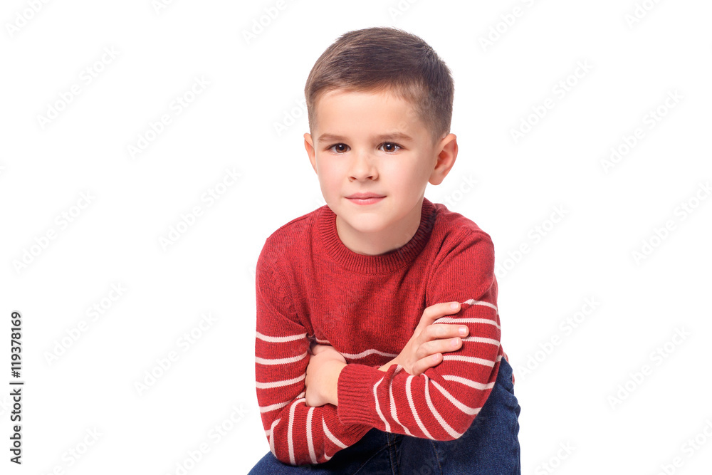 Proud boy in autumn clothes posing on white background. Proud boy in autumn clothes posing on white background.