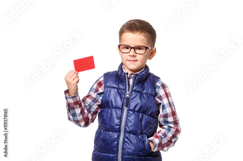 Boy holding a credit card on white background.