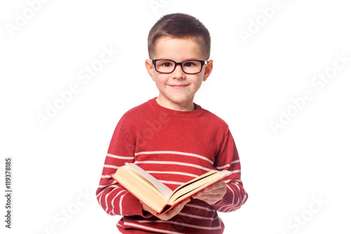 Child student with a book isolated over white background.