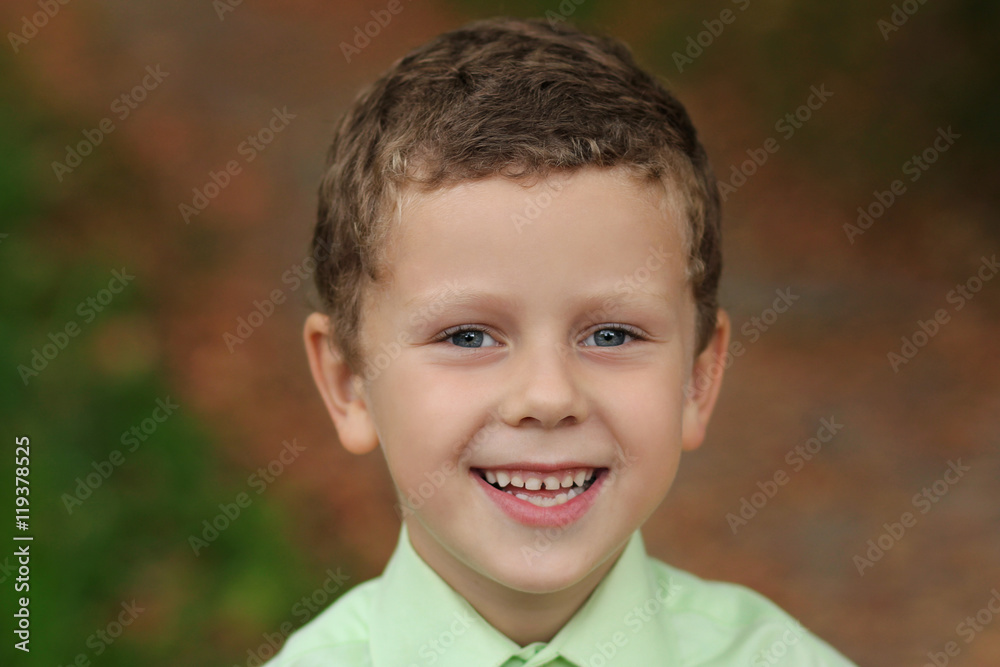 Portrait of funny smiling kid with deep grey eyes Portrait of funny smiling kid with deep grey eyes