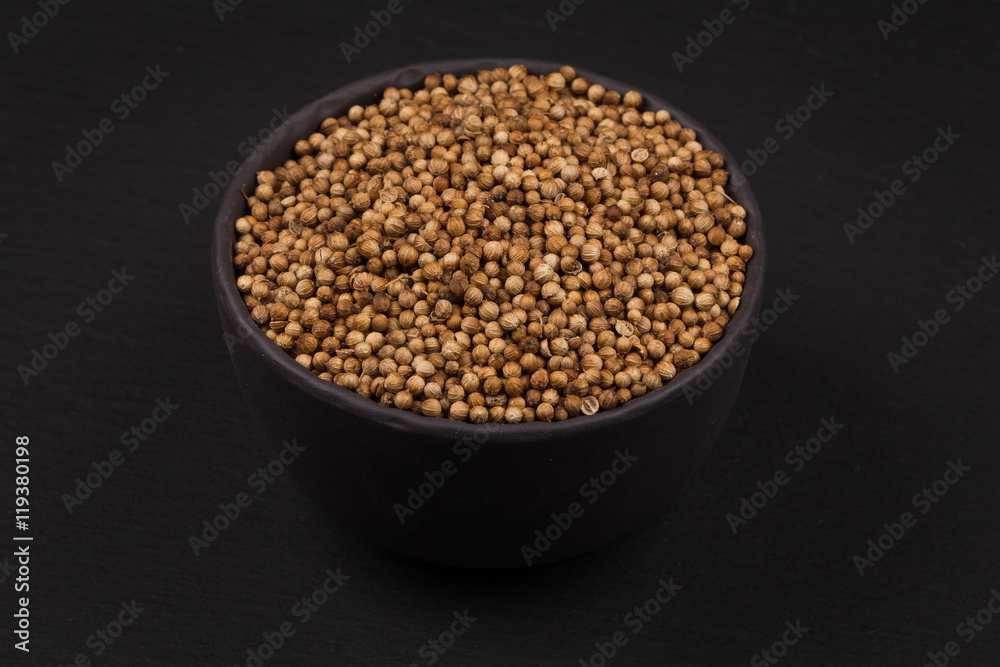 Coriander seeds in small bowl Coriander seeds in small bowl