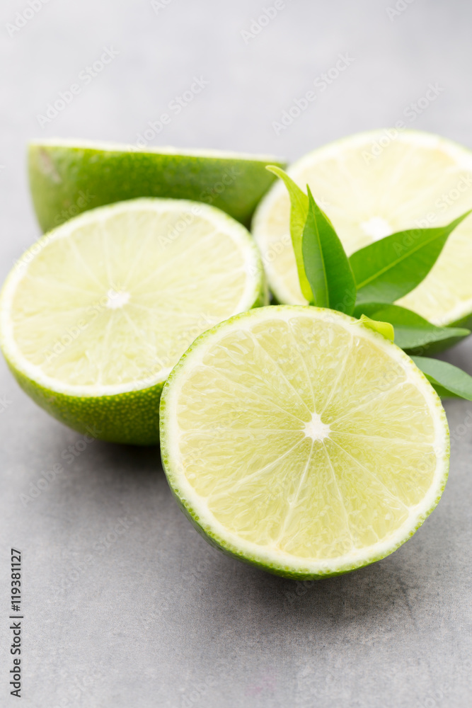 Juicy ripe lime an gray table. Juicy ripe lime an gray table.