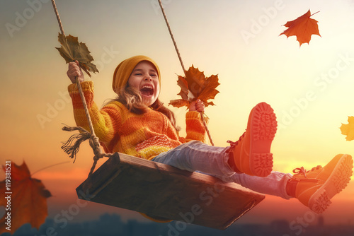 kid playing in the autumn