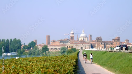 Cyclists riding towards Mantua
