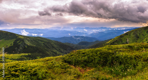 Picturesque and dramatic Carpathian mountains landscape, sunset evening time, panorama view, Ukraine. © O.Farion