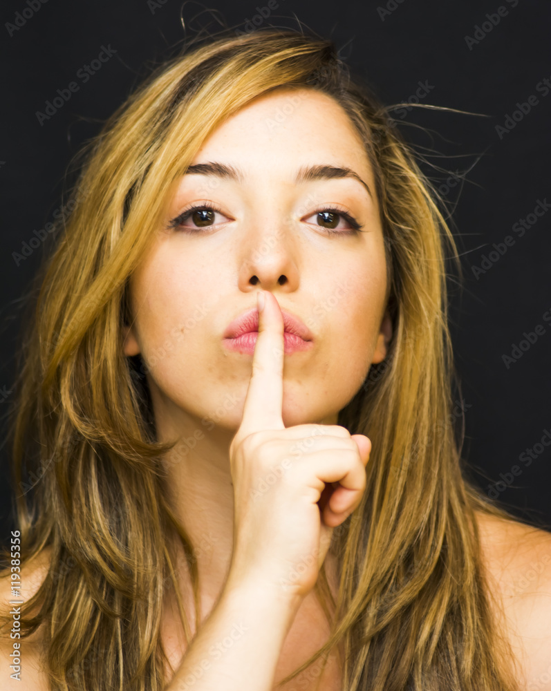 Portrait of a beautiful woman commanding silence Portrait of a beautiful woman commanding silence