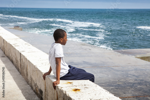 Canvas Print Portrait of a african boy on the seashore