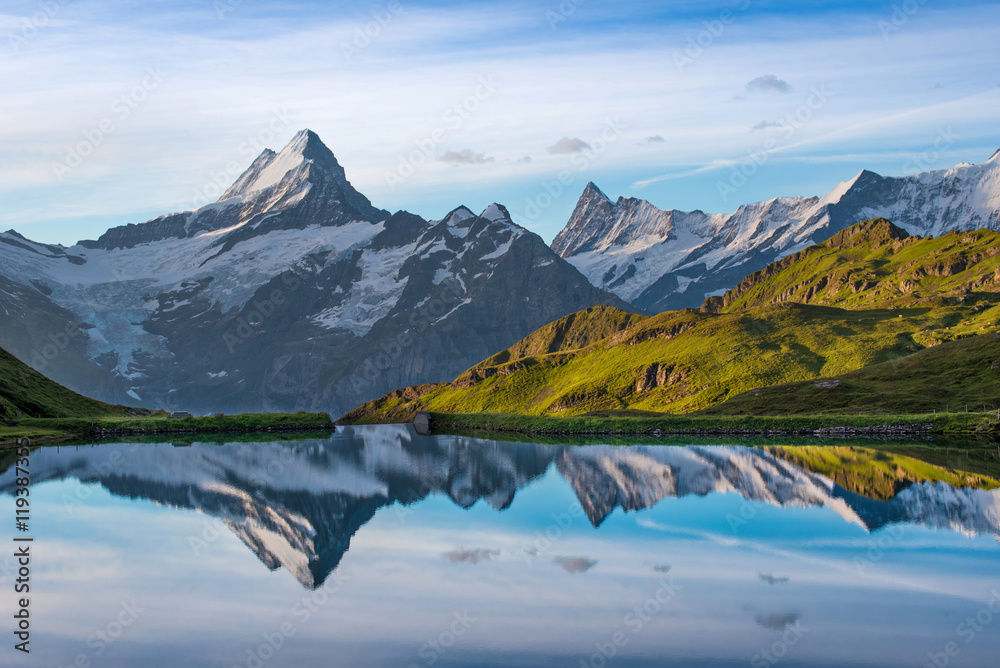 Fantastic landscape at sunrise over the lake in the Swiss Alps,