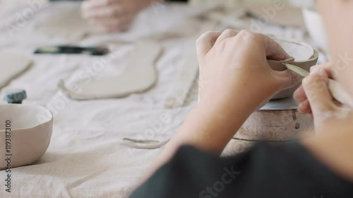 Female potter creating a bowl. 