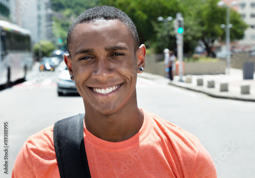 Happy african american male student in city © Daniel Ernst