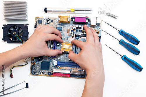 electronics repair. soldering microchips and circuit boards