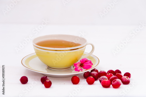 A cup of tea and cranberries