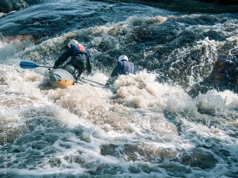 Toned image coordinated team of rowers in helmets and life jackets ...