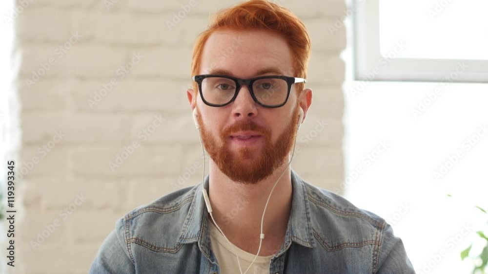 Taking Online, Video Chat, Skype by Man with Beard and Red Hairs