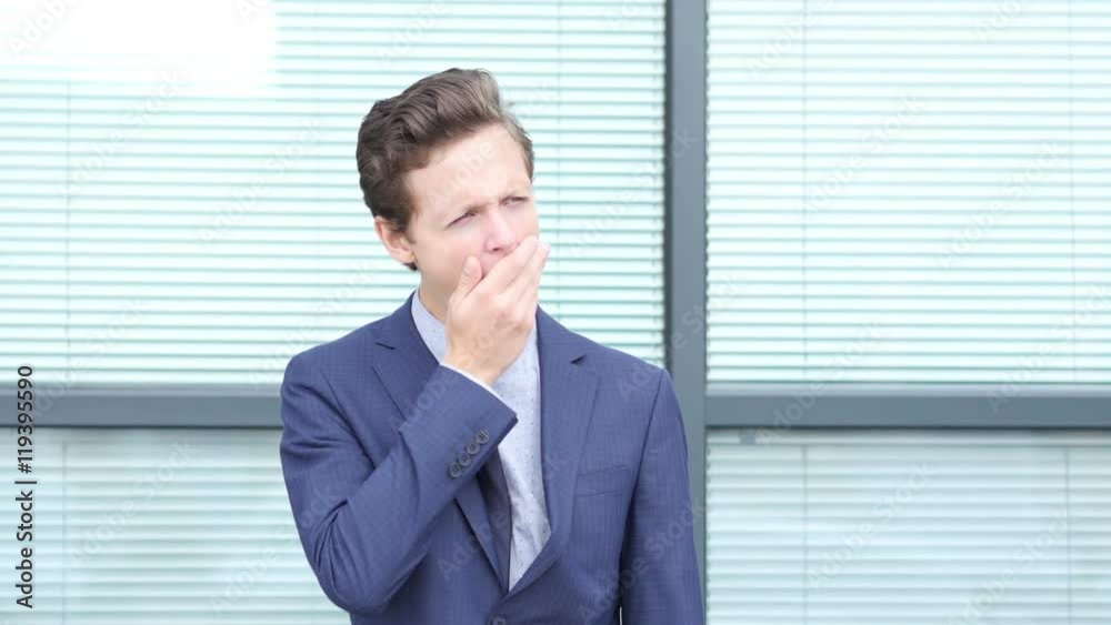 Yawning Gesture by Tired Young Businessman