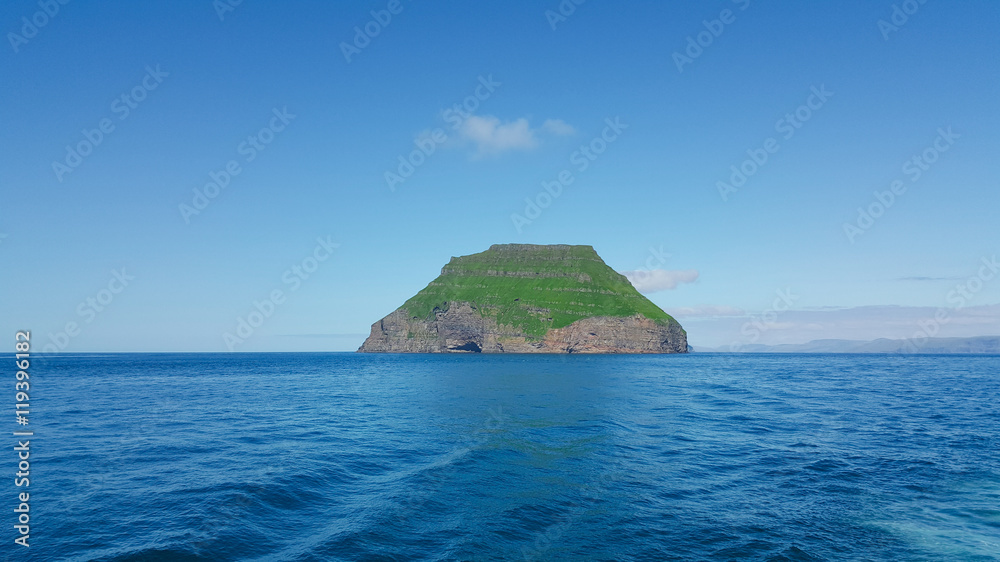 Alone green Faroe island Lítla Dímun in the Atlantic ocean