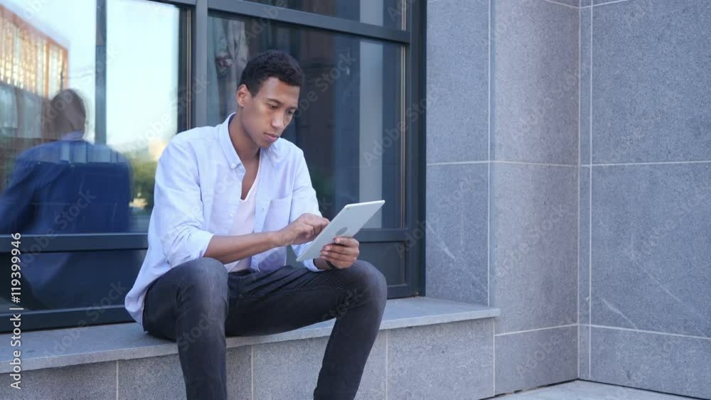 Outdoor Browsing on Tablet Computer, Young Black Handsome Man Outdoor Browsing on Tablet Computer, Young Black Handsome Man
