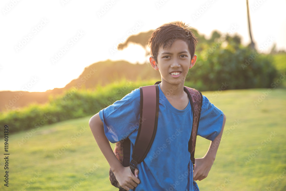 happy boy carrying bagpack smiling happy boy carrying bagpack smiling