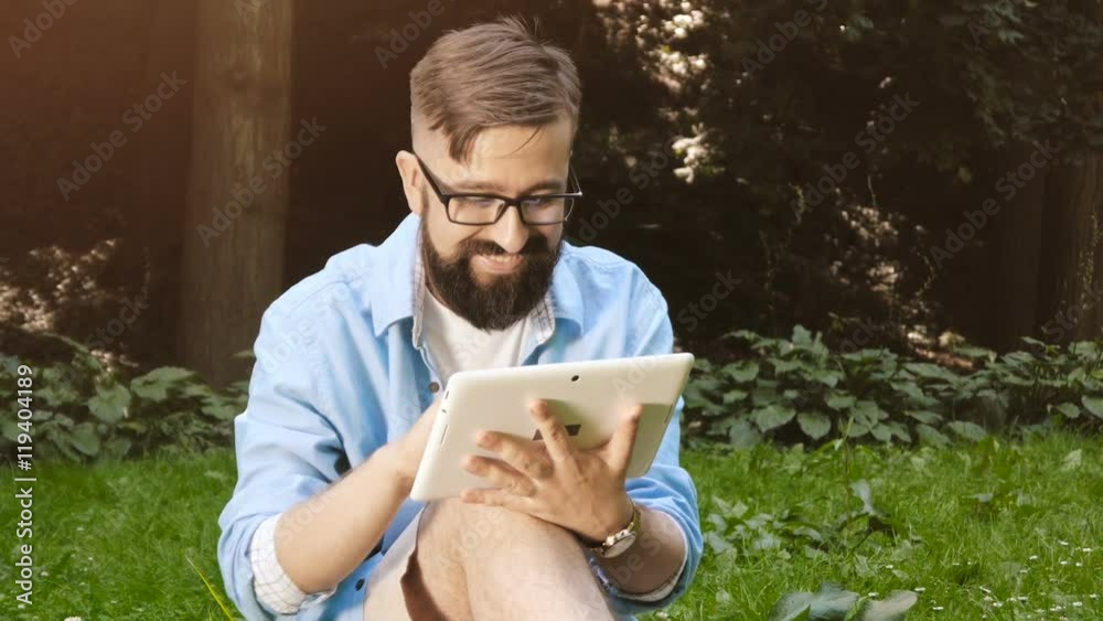 Smart casual man with digital tablet outdoors, close up. Modern remote work concept. Smart casual man with digital tablet outdoors, close up. Modern remote work concept.