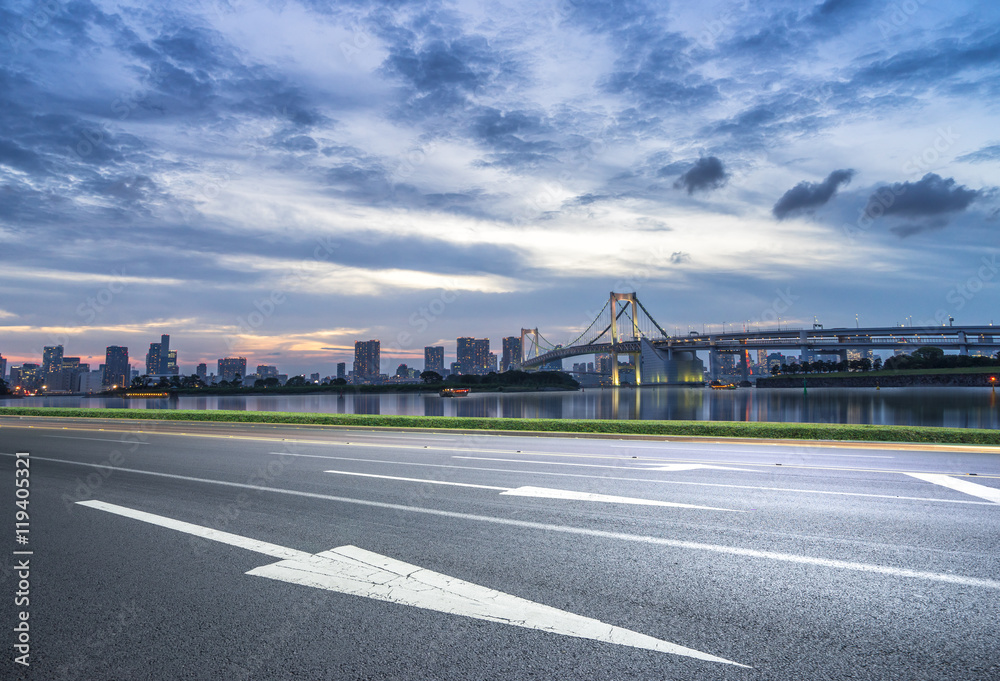 cityscape and skyline of tokyo at sunset from empty road cityscape and skyline of tokyo at sunset from empty road