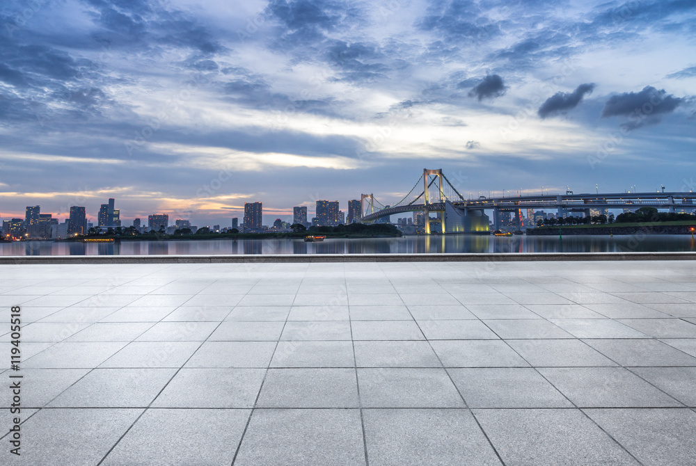 cityscape and skyline of tokyo at sunset from empty floor